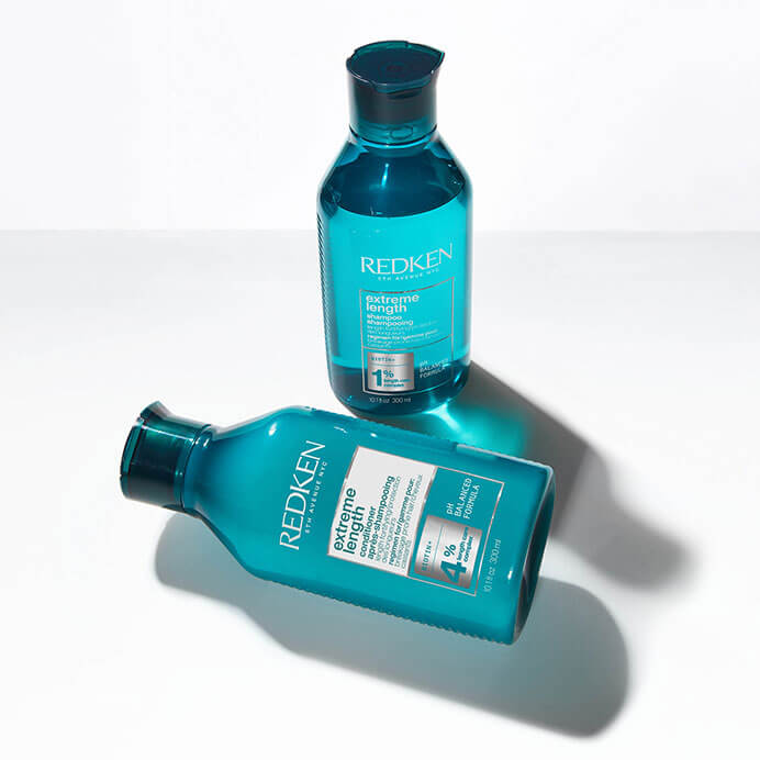 Imagem mostrando o shampoo e o condicionador da linha Extreme Lenght | Redken